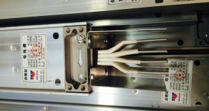 封閉式母線槽對(duì)200MW及以上發(fā)電機(jī)引出線回路中采用分相封閉母線的目的是什么？